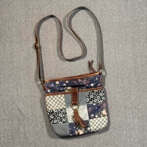 Navy blue floral patchwork crossbody bag with adjustable strap